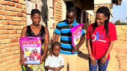 Group of people distributing mosquito nets