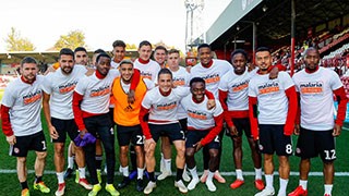 Team photo of Brentford FC in Malaria No More t-shirts